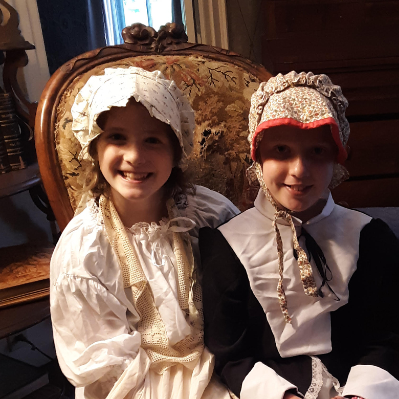 girls dressed in colonial clothing
