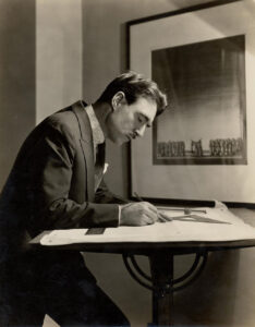 Robert Edmond Jones working at his drafting table